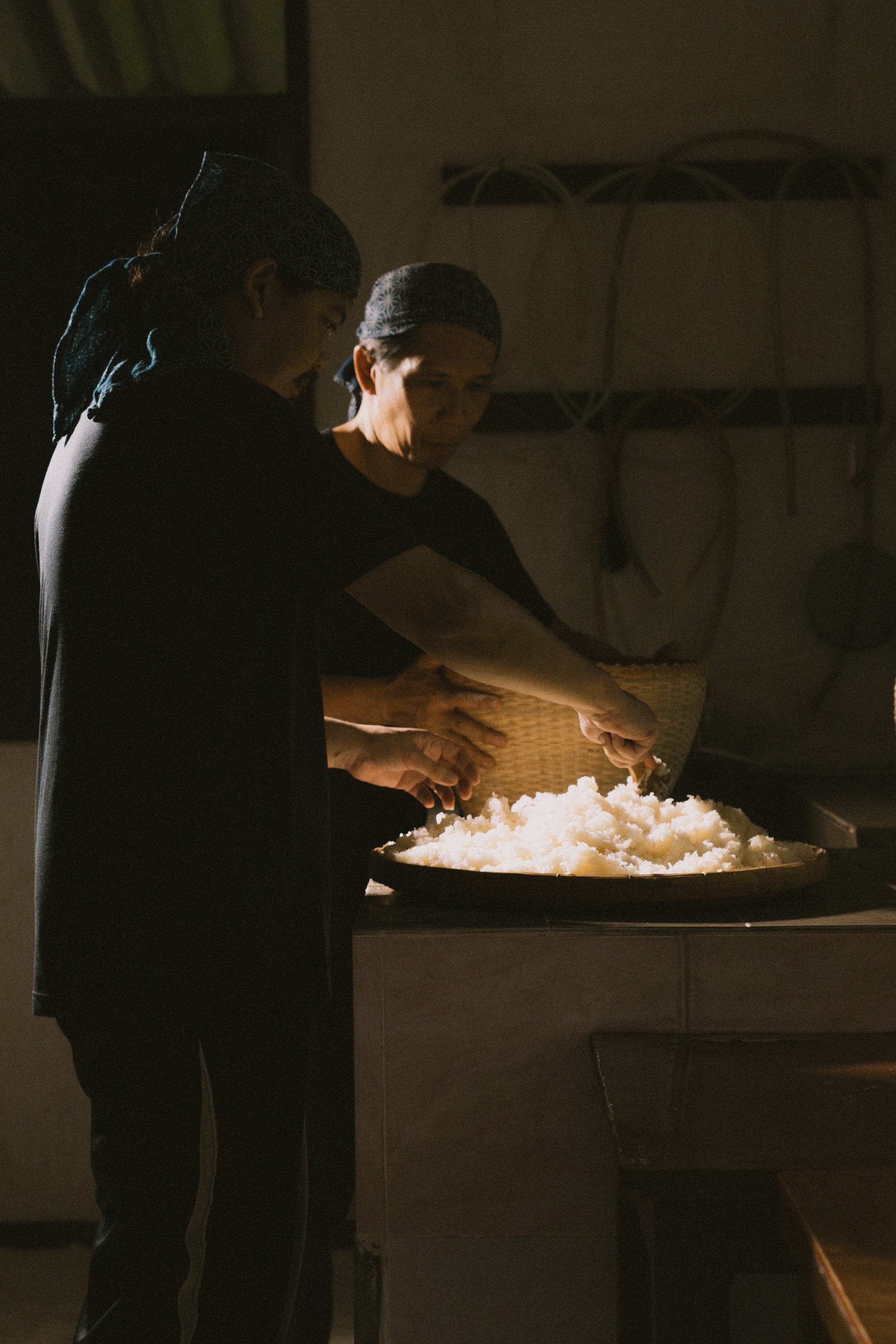Hands holding sticky rice — crafted in Chiang Mai